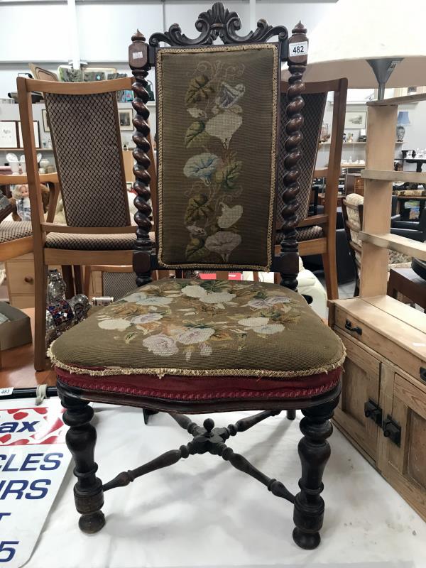 A Victorian mahogany chair with tapestry seat and back