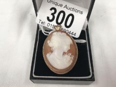 A fine shell cameo pendant/brooch in 9ct gold mount