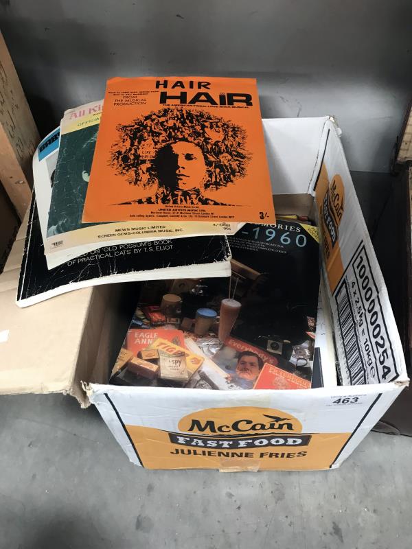 A box of sheet music and music books