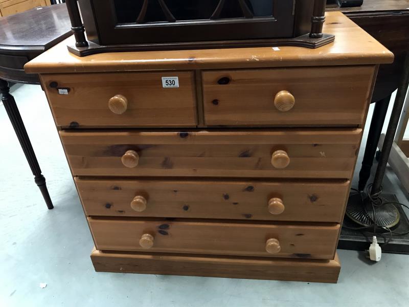 A 2 over 3 pine chest of drawers