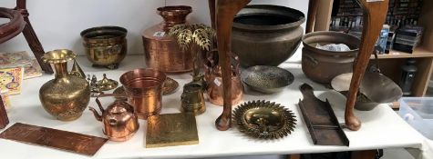 A large quantity of copper and brassware including eastern gourd, teapots etc.