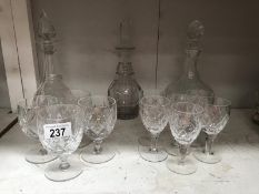 3 glass decanters and 10 wine glasses