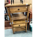 A pair of oak bedside cabinets