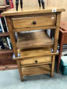 A pair of oak bedside cabinets