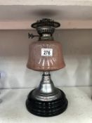 An old oil lamp base with glass font