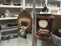 A brass front clock and 2 others