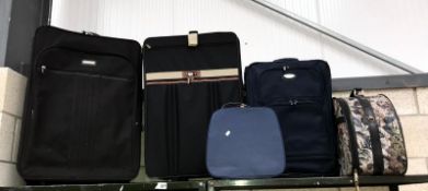 3 suitcases and 2 vanity cases