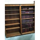 A pair of 6 shelf bookcases