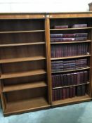 A pair of 6 shelf bookcases