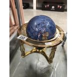 A gemset table globe