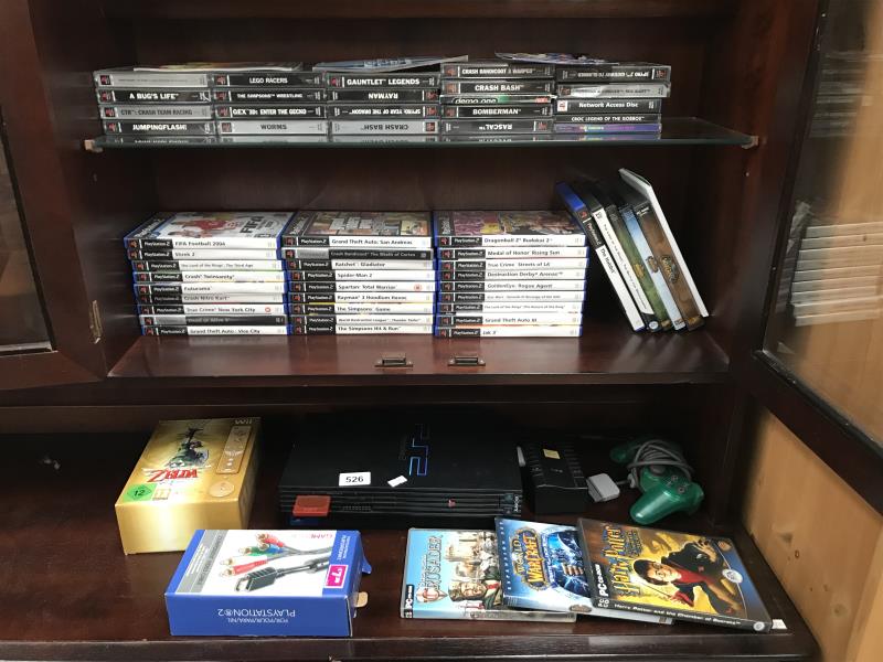 A Play Station 2 and a quantity of games