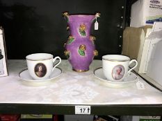 A pair of Norwegian cups and saucers and a vase