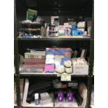 3 shelves of office supplies including files, wipes, pencils etc.