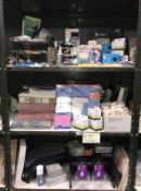 3 shelves of office supplies including files, wipes, pencils etc.