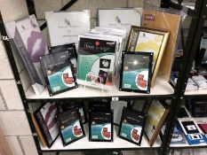 2 shelves of assorted photo frames