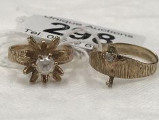 A 9ct gold ring featuring daffodil with central stone (possibly diamond) Size N and a 9ct gold ring