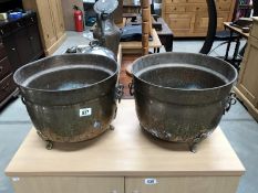 A pair of metal garden pots