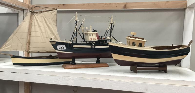 A model trawler and 2 other model boats