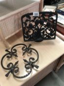 A cast iron book rest and trivet