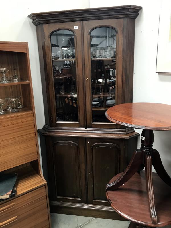 A Victorian mahogany glazed top corner cabinet