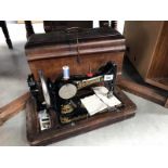 A cased Frister & Rossman sewing machine