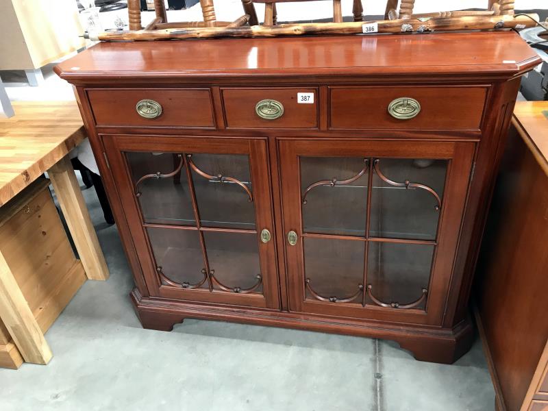 A mahogany astragal glazed cabinet