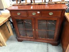 A mahogany astragal glazed cabinet