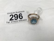 A 9ct gold ring set aquamarine and diamonds.