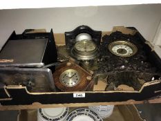 A selection of clock cases, some with movement,