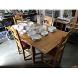 An extending dining table and 4 chairs