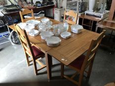 An extending dining table and 4 chairs