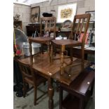 An oak draw leaf table and 4 chairs