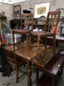 An oak draw leaf table and 4 chairs