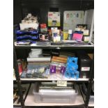 3 shelves of office supplies including files, cling film etc.