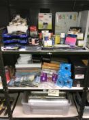 3 shelves of office supplies including files, cling film etc.