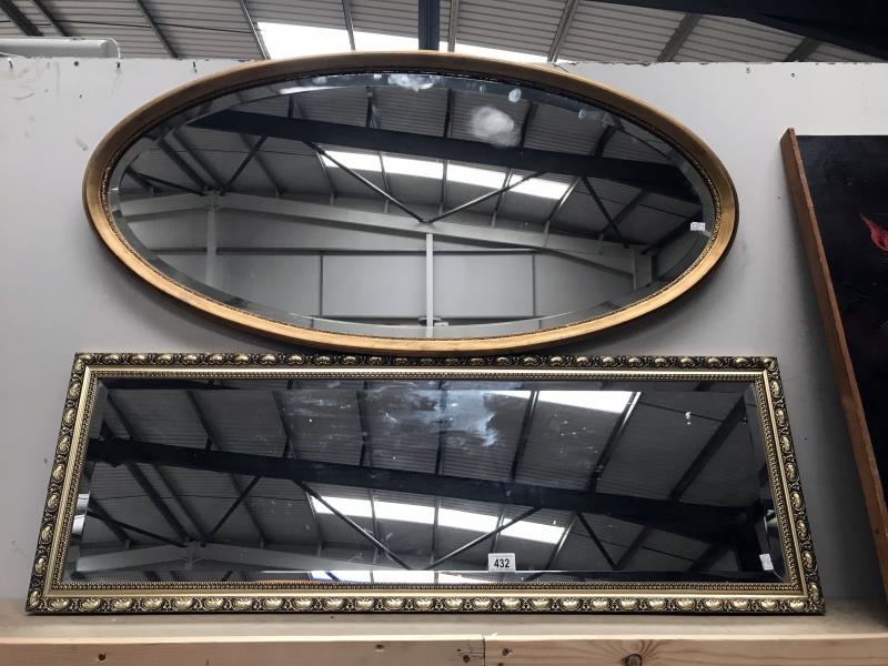 An oval and a rectangular bevel edge wall mirrors in gilt frames