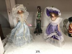 2 jointed porcelain dolls and a figure