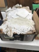 A large box of quality household linens and embroidered textiles including tray mats and doilies