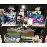 2 shelves of office supplies including files etc.