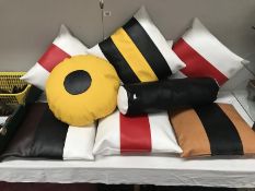 A collection of liquorice allsorts shaped cushions