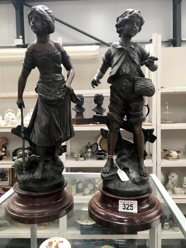 A pair of 19th Century metal figures