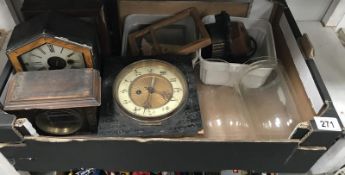 A selection of clock parts including cases, glass domes etc.
