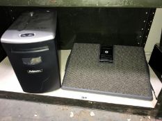 A paper shredder and computer foot rest