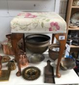 A dressing table stool on pad feet