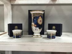 A Royal Worcester vase and 2 candle holders (all boxed)