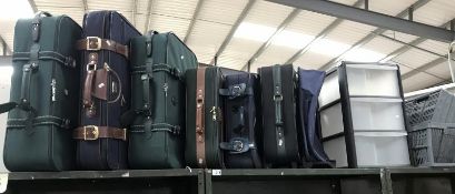 6 suitcases, a holdall,