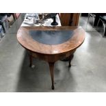 A D shaped table with leather inset