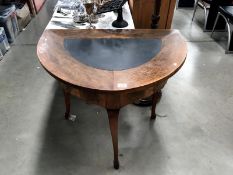 A D shaped table with leather inset