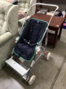 A silver cross baby buggy