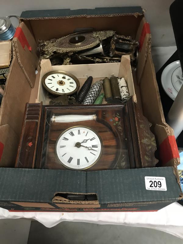 A collection of good clock parts including brass and other cases